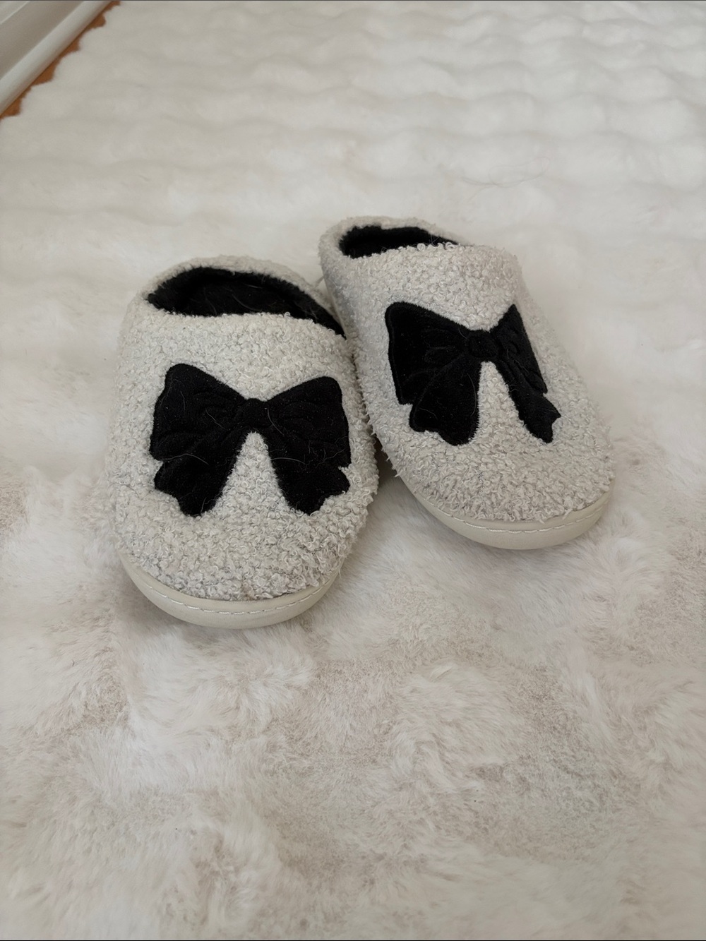 Cozy Cream Kids Slip-On Slippers with Black Bow